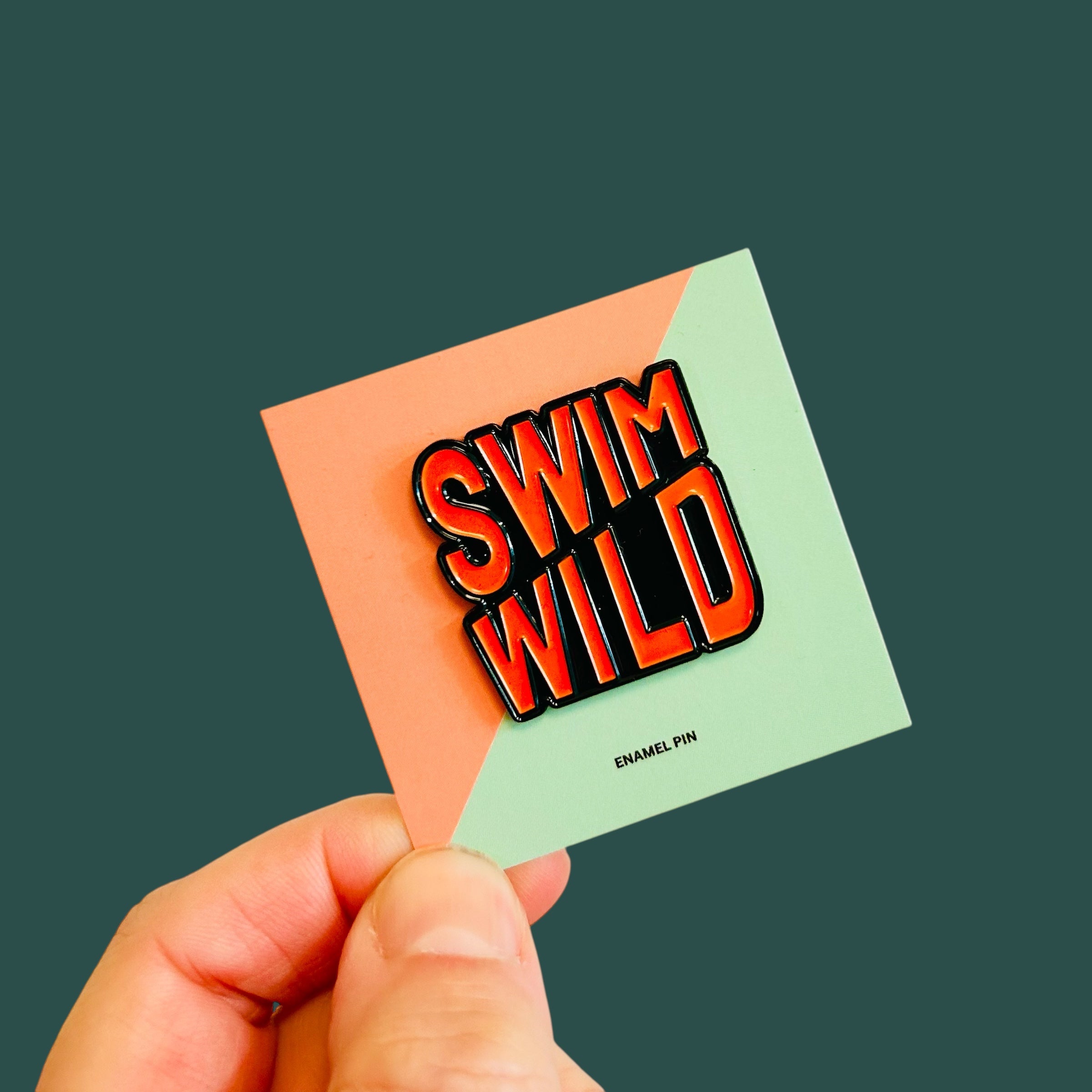 Swim Wild pin badge