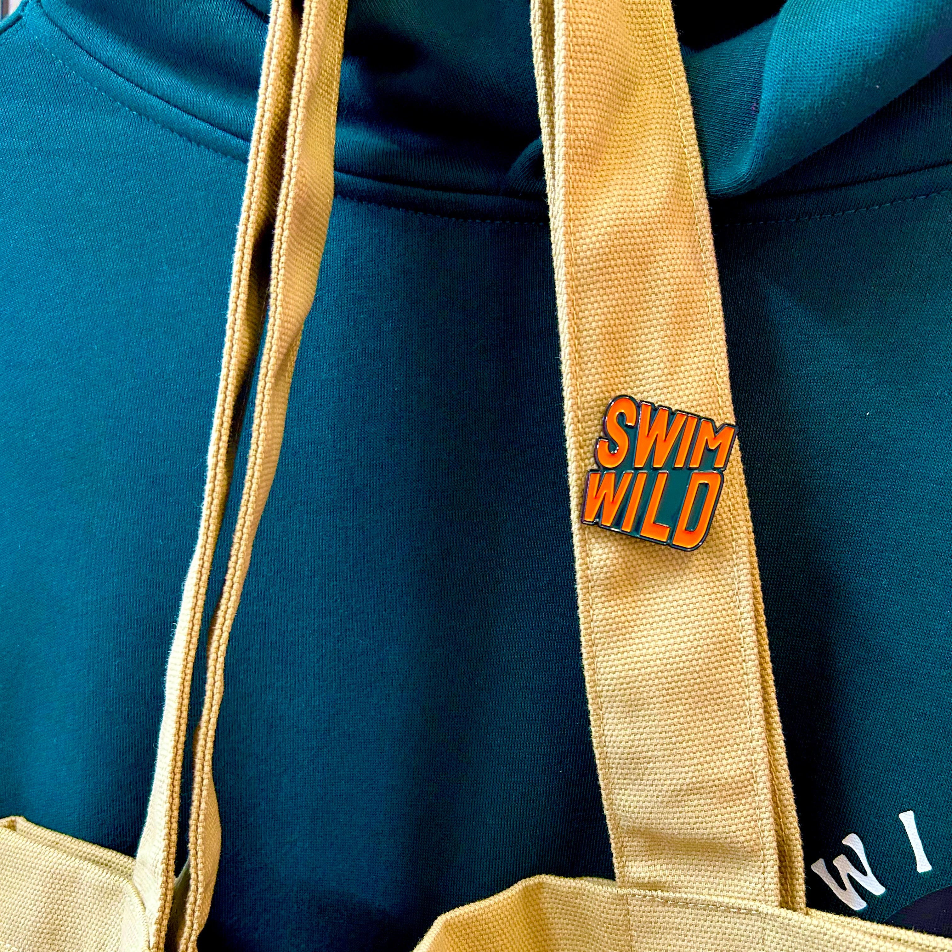 Swim Wild pin badge